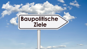 Ein Wegweiser mit dem Text "Baupolitische Ziele"